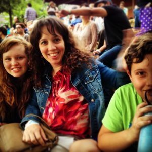 Ms. Noelle and her kids waiting to hear DMK perform at the Pearl Brewery Amphitheater. 