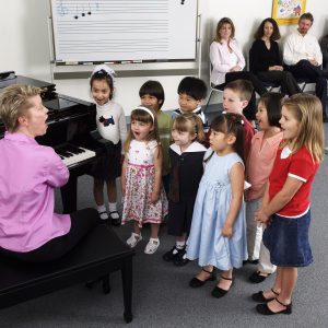 Children singing together in a Yamaha Music Class.