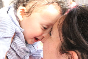 Baby Smiling With Mom