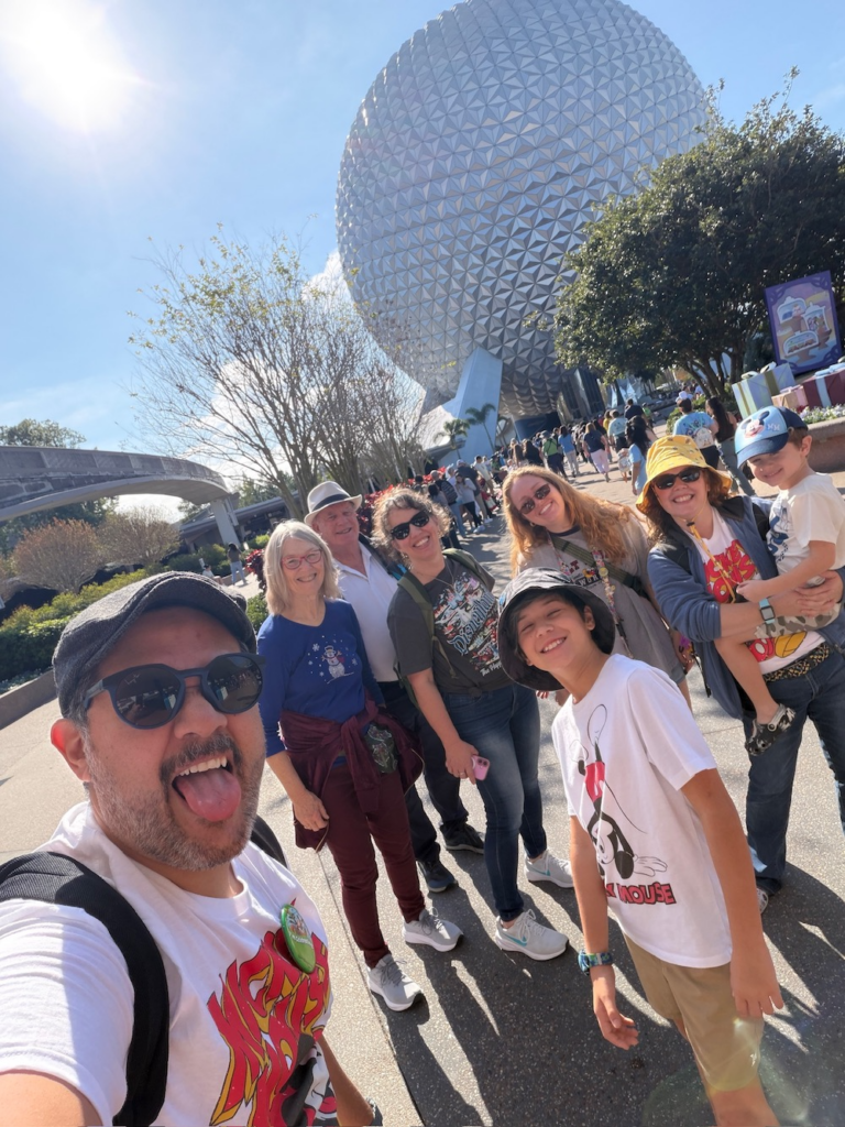 the jensen family in front of the Epcot ball